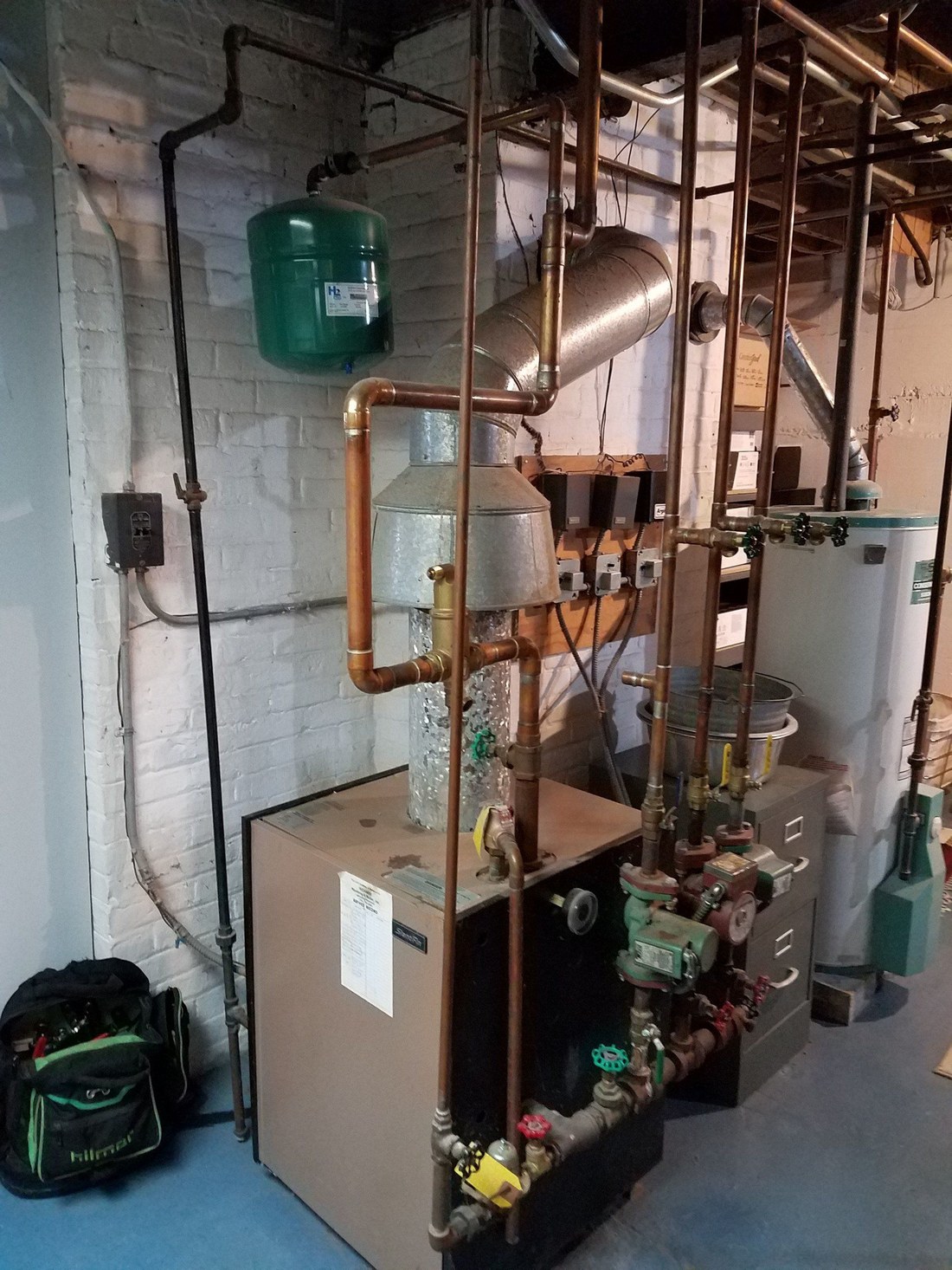 Furnace room with new equipment and copper piping