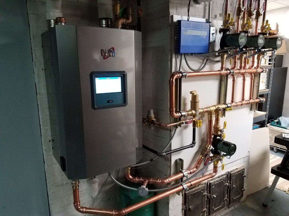 Boiler room piping installed by the JC team