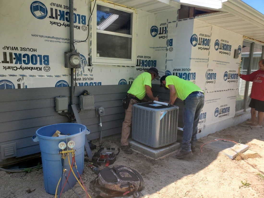 JC crew installing a new system in a home under construction