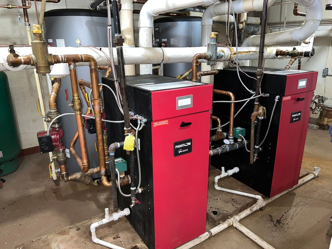 Red boiler with new piping in a Janesville home