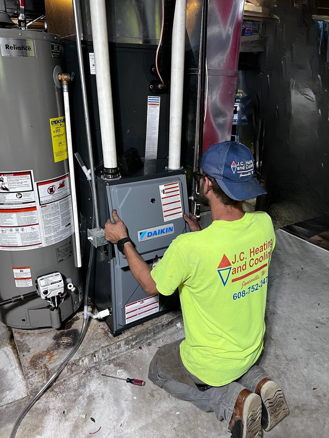 JC technician working on a furnace